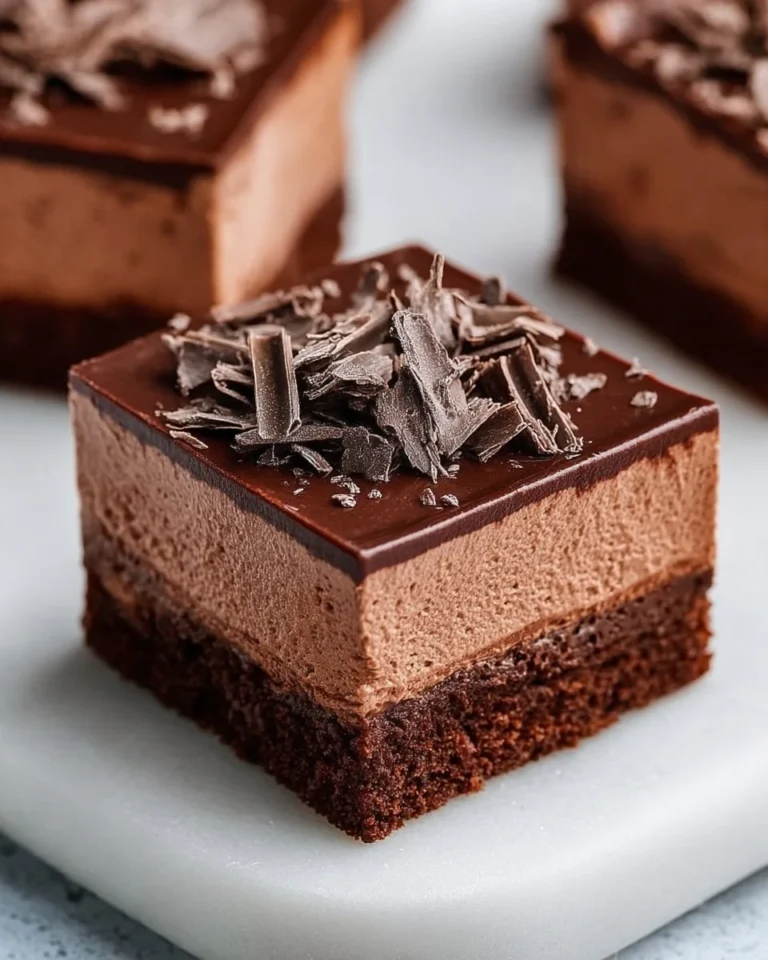 Delicious chocolate mousse brownies topped with creamy chocolate ganache
