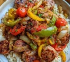 Sausage, Onion, Bell Peppers & Tomatoes Over Rice