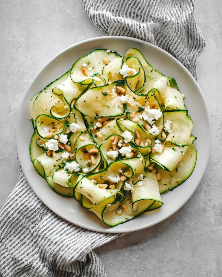 Fresh Zucchini Ribbon Salad with colorful vegetables and dressing