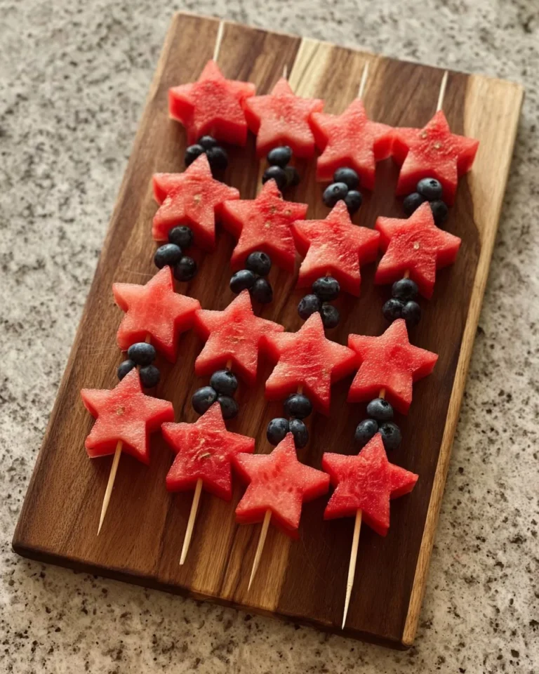 Colorful star-spangled fruit skewers arranged for a festive celebration.