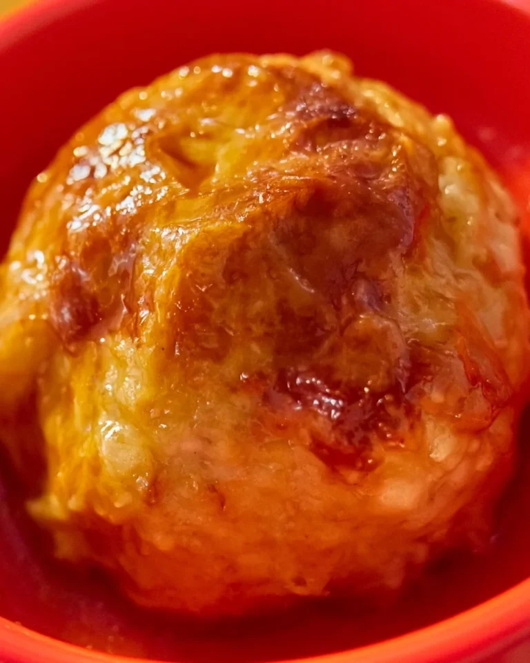 Delicious homemade apple dumpling on a plate, perfect for one serving.