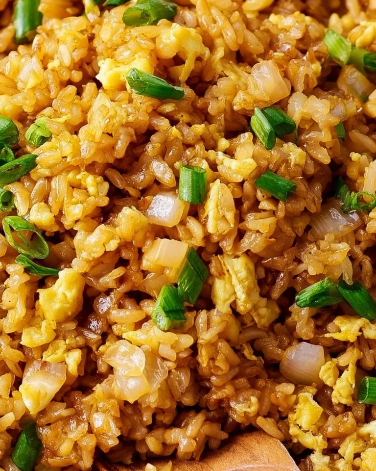 Delicious plate of Hibachi Fried Rice with vegetables and grilled chicken.