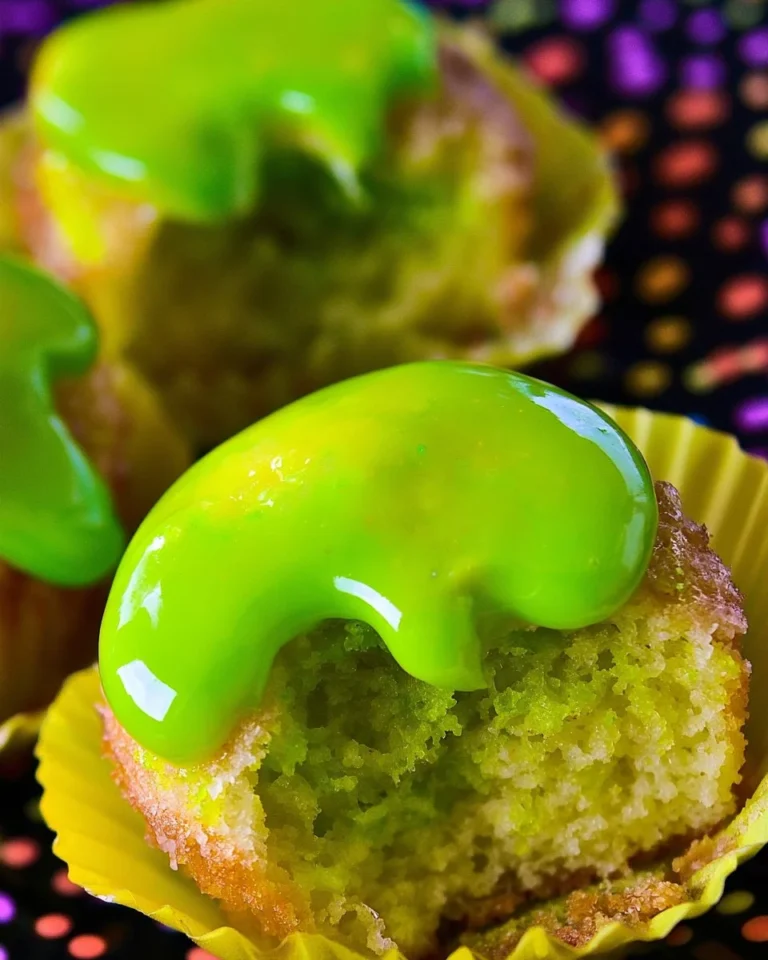 Slime filled coconut lime Halloween cupcakes decorated for a festive celebration
