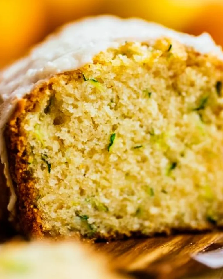 Delicious slice of homemade zucchini bread with fresh zucchini