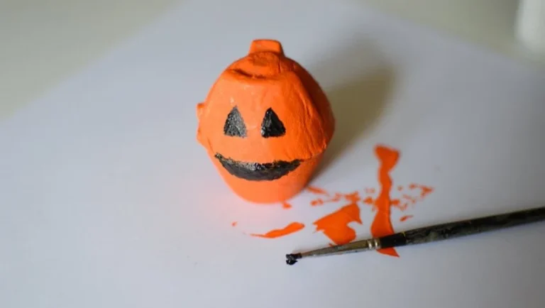 Kids enjoying an easy pumpkin craft activity for Halloween.