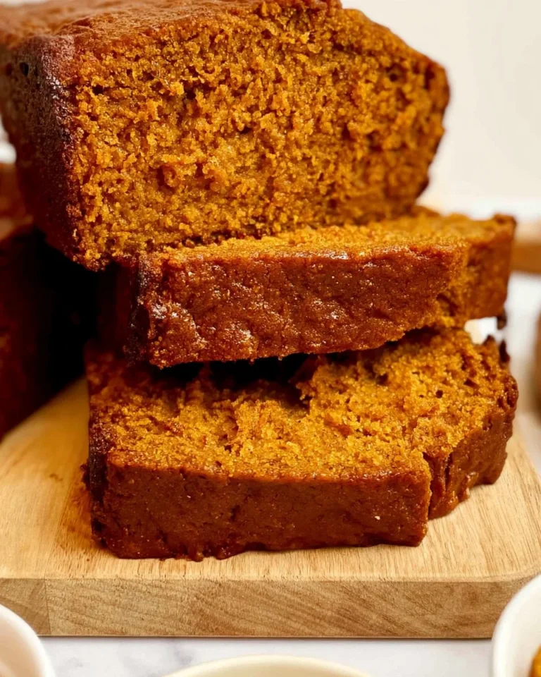 Slice of easy homemade pumpkin bread with spices and nuts