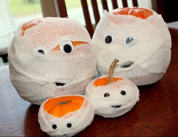 A charming family of Pumpkin Mummies perfect for Halloween decorations.