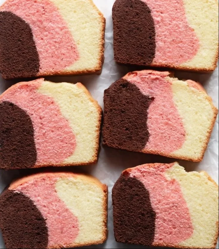 Delicious Neapolitan Pound Cake with chocolate, vanilla, and strawberry layers.
