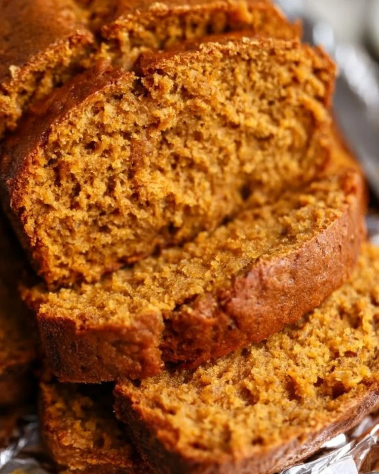Loaf of freshly baked Pumpkin Banana Bread with spices and nuts